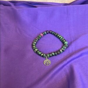 Green Beaded Bracelet with Silver Charm